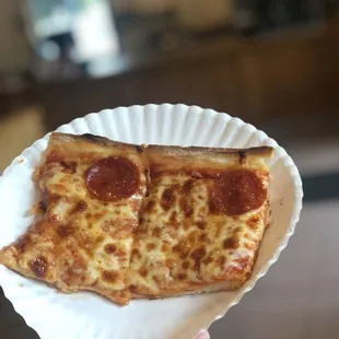 two slices of pepperoni pizza