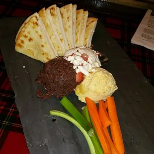 The Triple dip is deliah...Hummus, olive tapenade and garlic goat cheese with dipping veggies and pita bread.  Try it!