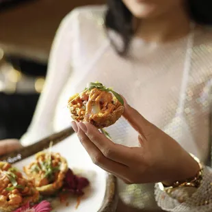 a woman holding a plate of food