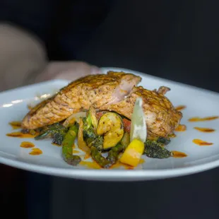 a person holding a plate of food