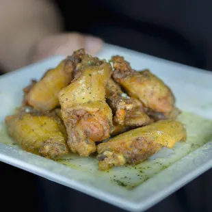 a plate of fried chicken wings