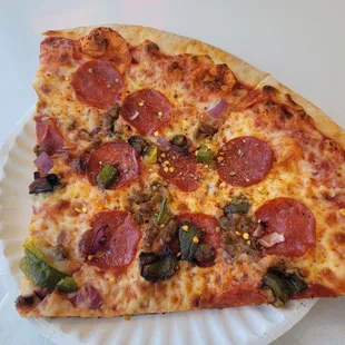 supreme slice with chili flakes and garlic powder