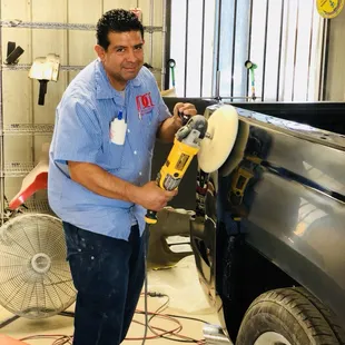 Owner Erick Duran polishing a 2014 Silverado.