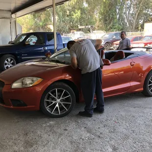 Putting Melissa's Car together. Our team hard at work.
