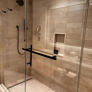 Large shower with hand held option.