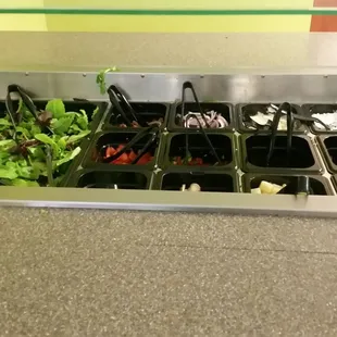 salads and salad dressings in trays