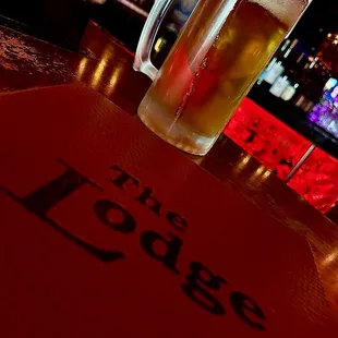 a glass of beer on a table