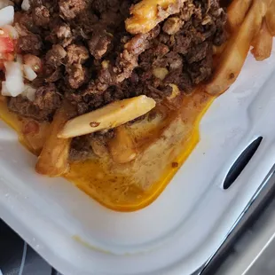 No cheese just grease pools.  Wrong meat, they put birria meat on the asada fries