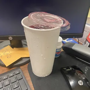 a cup of coffee on a desk