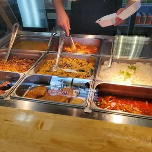 Serving a daily selection of PR food - The Pollo Guisado was delicious!