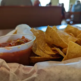 a basket of chips and salsa