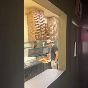 a man making pizzas
