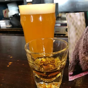 a glass of beer and a picture of a bear