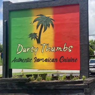 a sign for a jamaican cuisine restaurant
