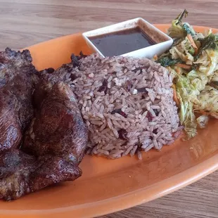 Pork steak, peas n rice and fried cabbage.