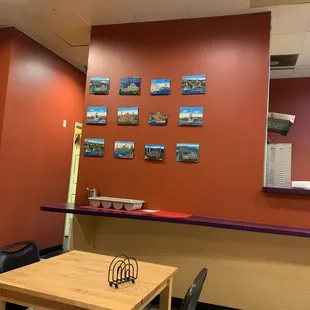 a dining area with a table and chairs