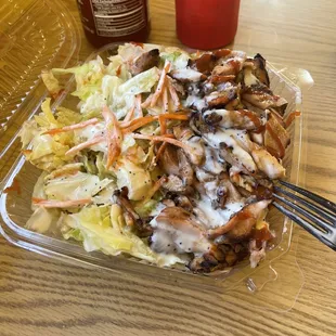 Chicken no rice smothered in their amazing dressing, teriyaki sauce and sriracha