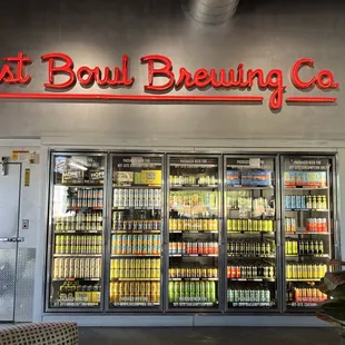 Entry featuring canned beers for purchase.