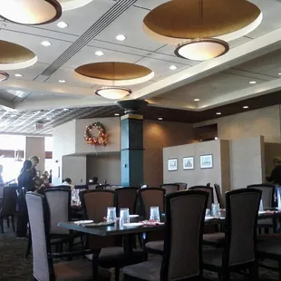 a dining room with tables and chairs