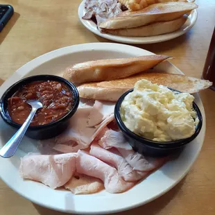 Turkey, beans, garlic toast, and potato salad