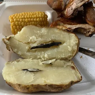 Baked potato with rot down to the skin
