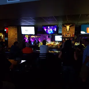 people sitting at the bar