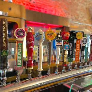 a row of beer taps