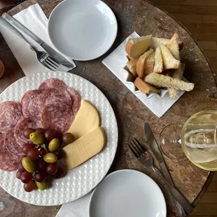 Happy hour. Smoked Gouda and salami plate.