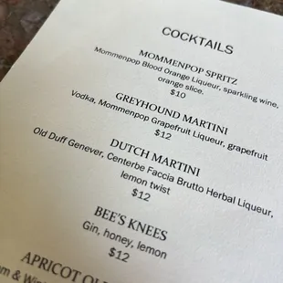 a menu on a marble table