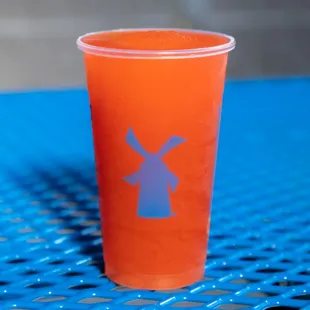 a plastic cup with a windmill on it