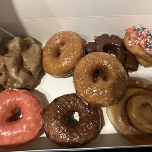 Maple buttermilk, Brown cake pink frosted, Blueberry cake, Cinnamon roll, pumpkin donut