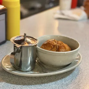 a bowl of bread and a saucer