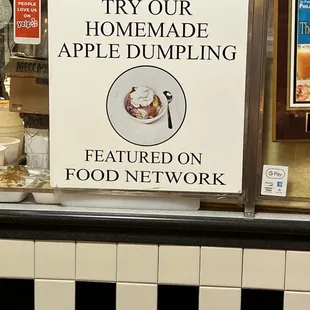 a sign that reads try our homemade apple dumpling featured on food network