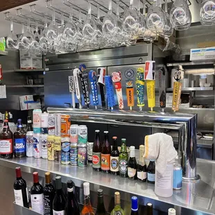 bottles of wine on a shelf in a restaurant