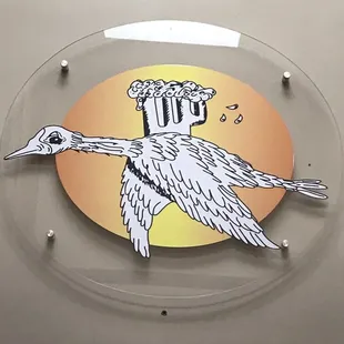 a glass plate with a bird on it