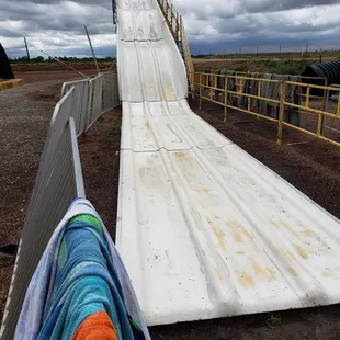 a man sliding down a slide