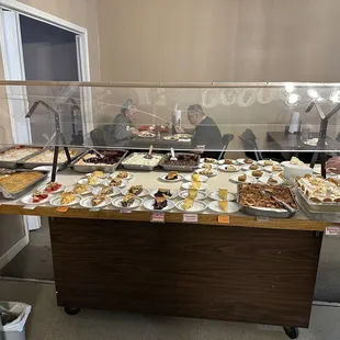 a man standing in front of a buffet