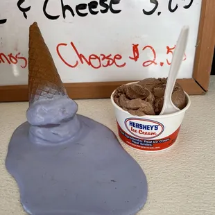 a cone of ice cream and a scoop of ice cream