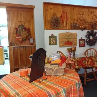 a dining room with a table and chairs
