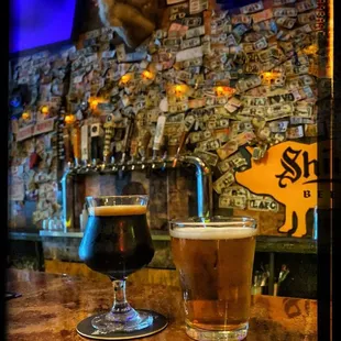 a glass of beer and a deer head