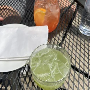 a drink and a napkin on a table