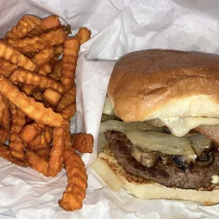 Bacon swiss mushroom burger with sweet potato fries.