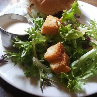 Classic Burger with a Garden Patty and a side salad.