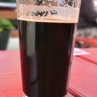 a glass of beer on a table