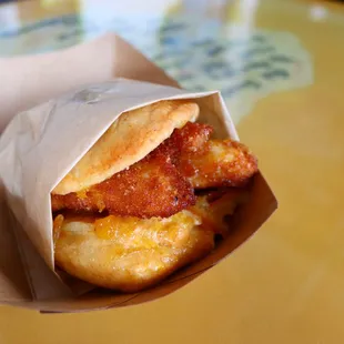 a sandwich wrapped in paper