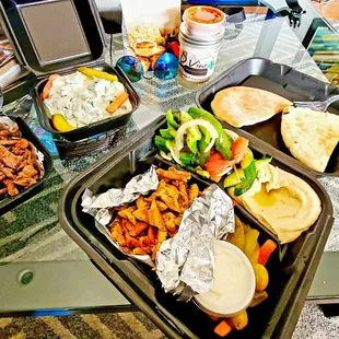 2 meat combo, hummus side, sub rice for Medi salad. Side of cucumber yogurt and jar of garlic spread.