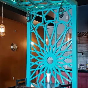 Lovely arbor providing visual interest and some virtual separation for diners.