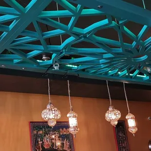 Lovely arbor providing visual interest and some virtual separation for diners.