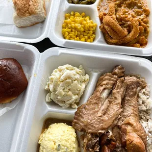 a variety of food items in styrofoam containers