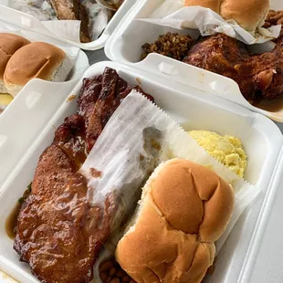 a variety of food items in styrofoam containers